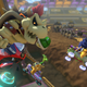 Dry Bowser, a bowser without skin, flies through the air on a motorcyle above a dirtbike track. He holds a green shell in his left hand.